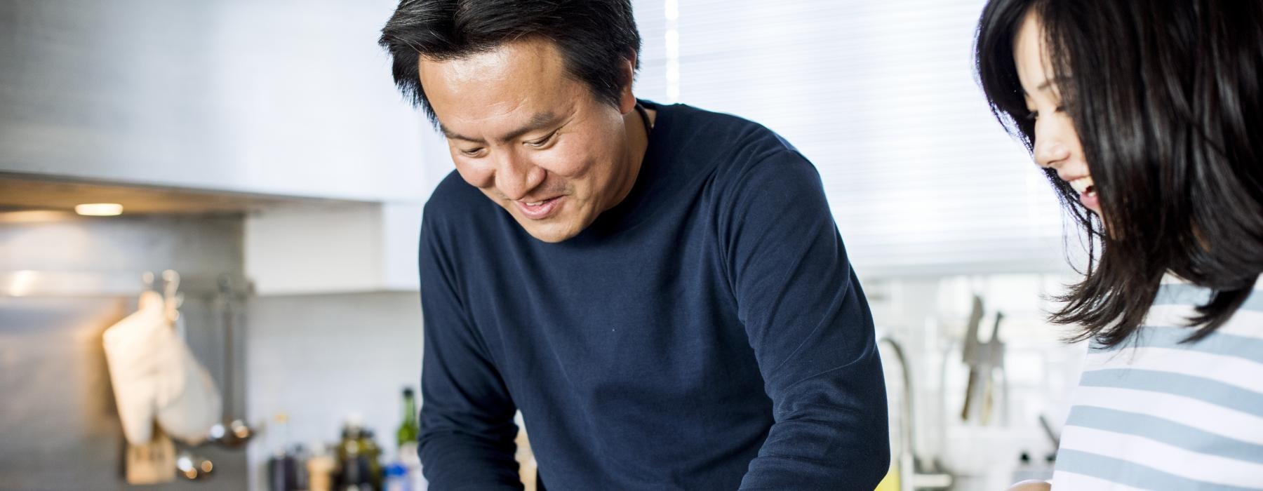 a man and a woman preparing food