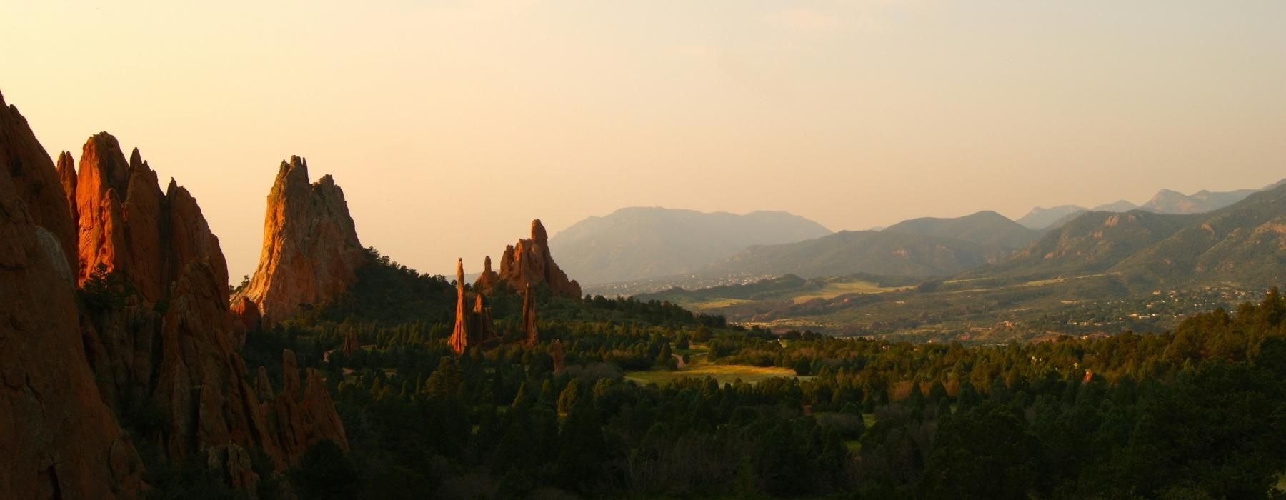 a landscape with trees and mountains